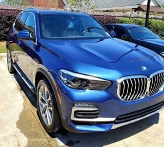 Bright blue BMW X5 with a polished metallic finish