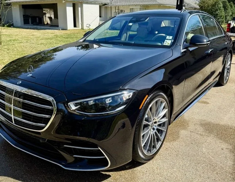 Black Mercedes-Benz S-Class sedan with a glossy finish