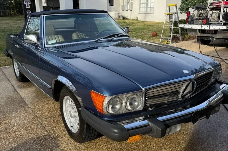 Vintage blue Mercedes convertible with a polished finish